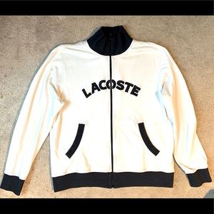 White Lacoste track jacket with navy blue letters